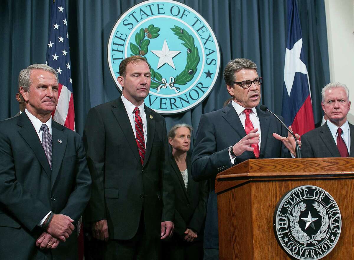 Texas Health Commissioner Kyle Janek (left), who was appointed to the job by then-Gov. Rick Perry in 2012, had been under fire over a state contracting scandal.