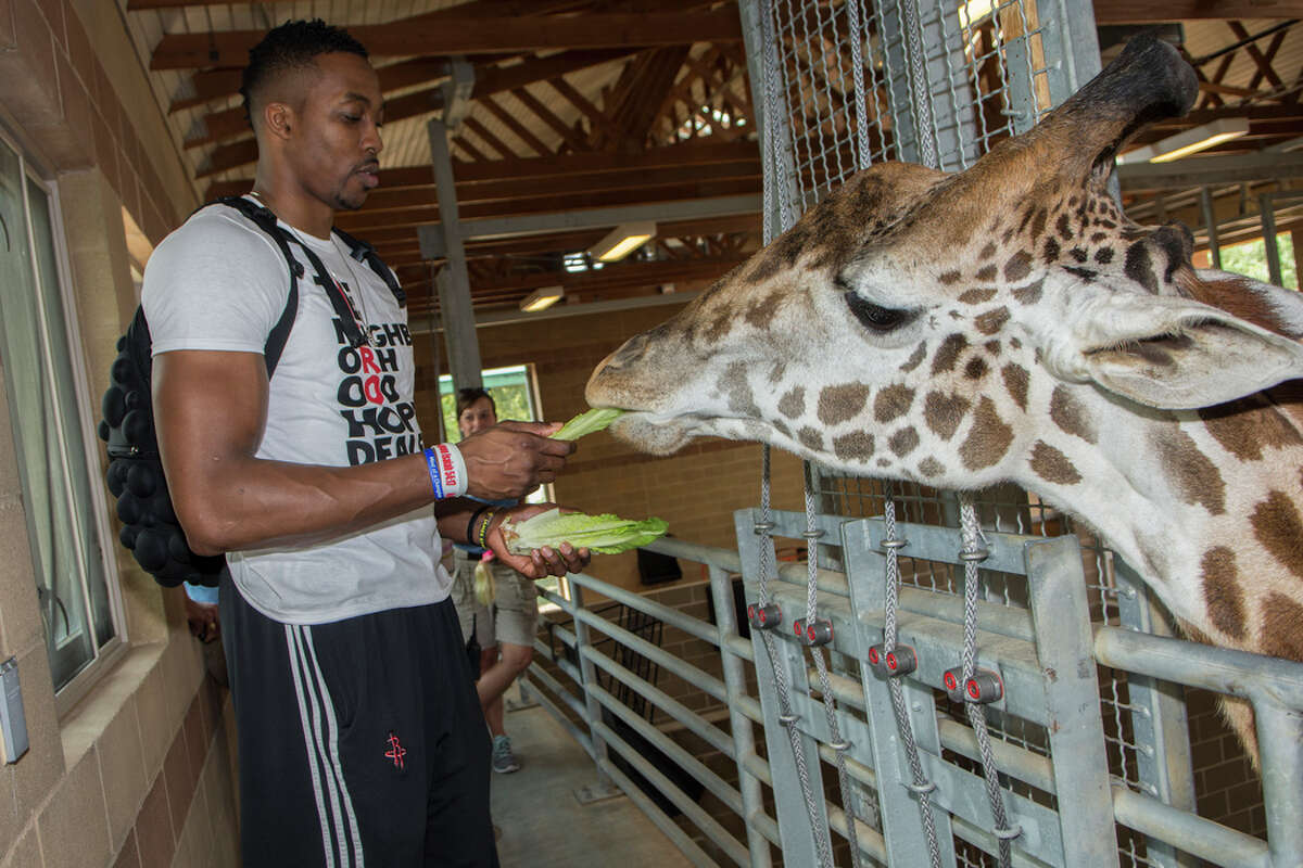 Dwight Howard is wearing a gigantic foam Astros cowboy hat