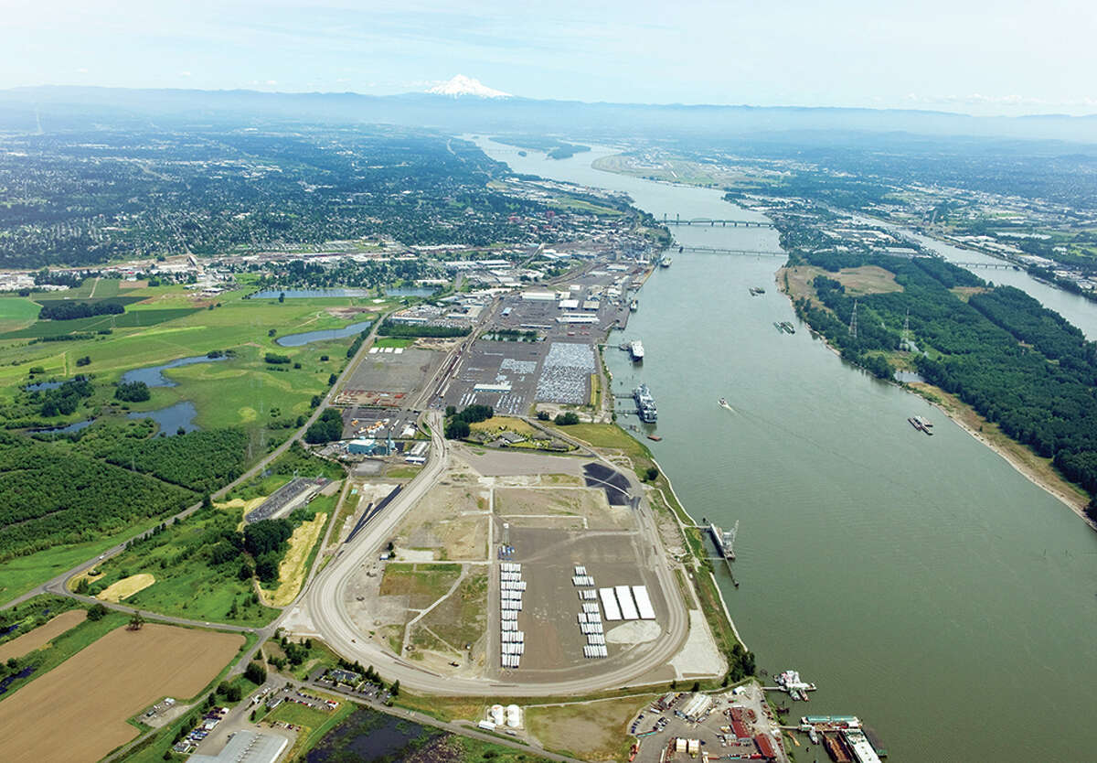 Tesoro Corp., with partner Savage Cos., hopes deliver favorably priced crude oil by rail to the area in the foreground of this aerial photo of the Port of Vancouver USA on the Columbia River, but the project has met with delays.
