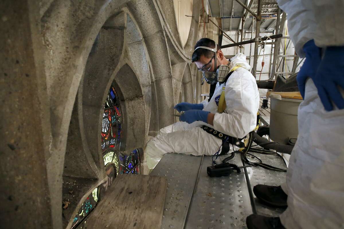 Tommy Nguyen works on the stained glass restoration at Grace Cathedral in San Francisco, Calif., as seen on Fri. June 5, 2015.