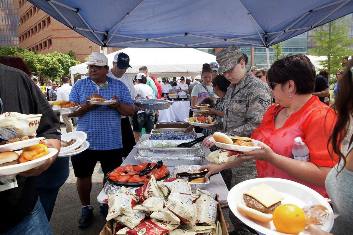 Patients, Hospital staff, Wounded Warriors and their families gathered as food was provided by with celebrity chef Robert Irvine, of Restaurant Impossible, Friday June 5, 2015 during Organization Day at Gary Sinese's annual visit to San Antonio Military Medical Center.