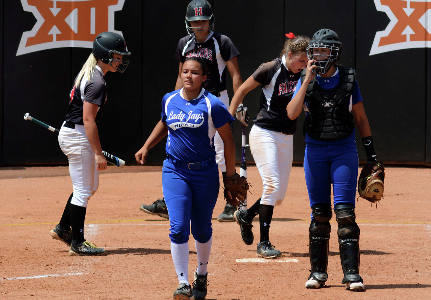 Video: Did Needville catcher intentionally elbow Huffman softball players?