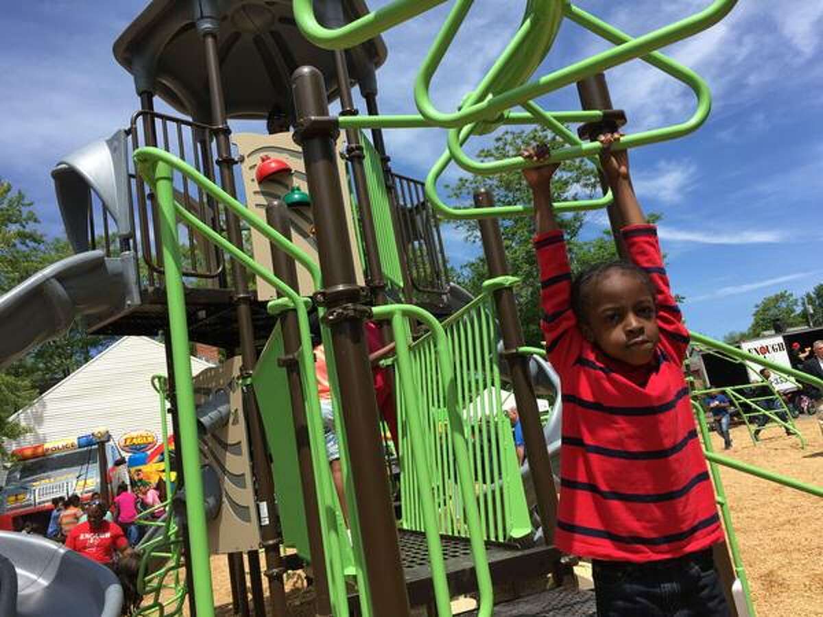Children play at the new Oak Park during the official opening. (Cindy Schultz/Times Union)