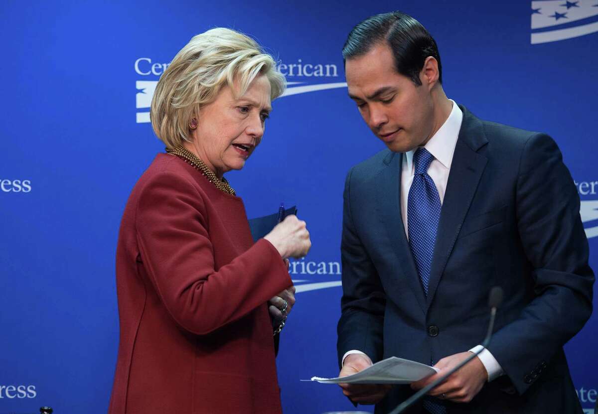 Former US Secretary of State Hillary Clinton talks with Housing and Urban Development Secretary Julian Castro after taking part in a discussion on "our nation's urban centers," and "challenges from housing and transportation to education and workforce accessibility" at the Center for American Progress (CAP) in Washington, DC, on March 23, 2015. AFP PHOTO/NICHOLAS KAMMNICHOLAS KAMM/AFP/Getty Images