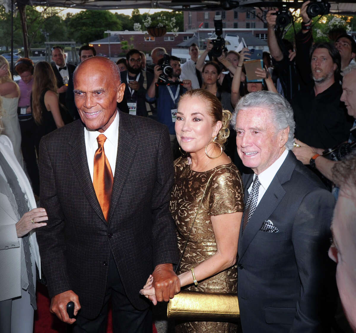 Honoree Harry Belafonte, left, with Kathie Lee Gifford, center, and Regis Philbin, right during the Greenwich International Film Festival Gala honoring Belafonte for his philanthropic work, particularly with UNICEF, at L'escale Restaurant & Bar in Greenwich, Conn., Saturday night, June 6, 2015. Gifford and Philbin were Master of Ceremonies for the gala.