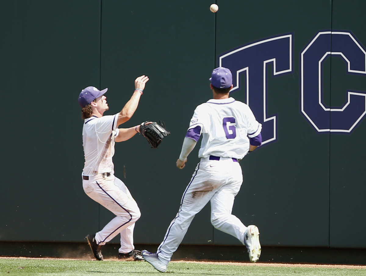 TCU outfielder Cody Jones, left, and Nolan Brown (6) chase the single hit by Texas A&M outfielder Jonathan Moroney during the sixth inning of a super regional of the NCAA college baseball tournament in Fort Worth, Texas, Saturday, June 6, 2015. (AP Photo/Jim Cowsert)