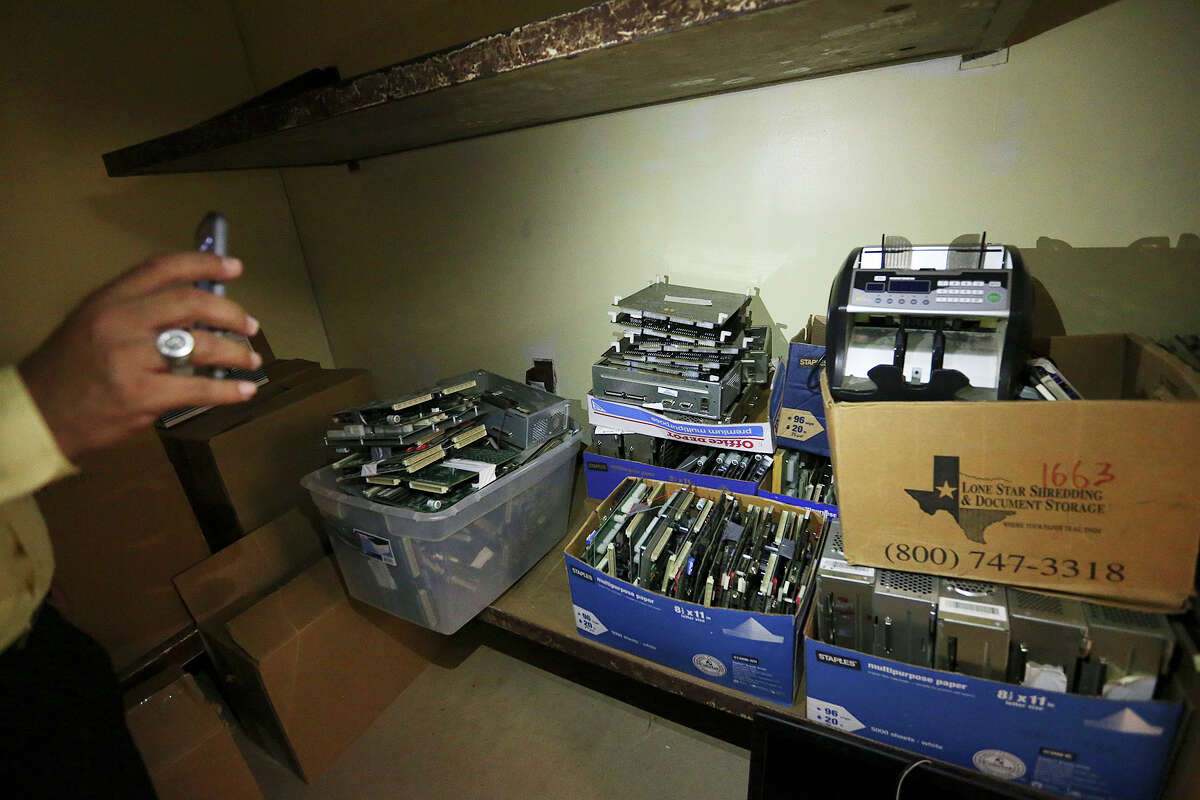 A Hidalgo County District Attorney investigator shows motherboards from eight liners gambling machines confiscate during raids on the establishments, Thursday, June 3, 2015. Hidalgo and Cameron counties have put pressure on gambling establishments forcing most of them to go underground. Last year, Starr county officials embraced this burgeoning industry when it passed a $500 licensing fee per slot machine, touting the $1.7 million it would generate for the county.
