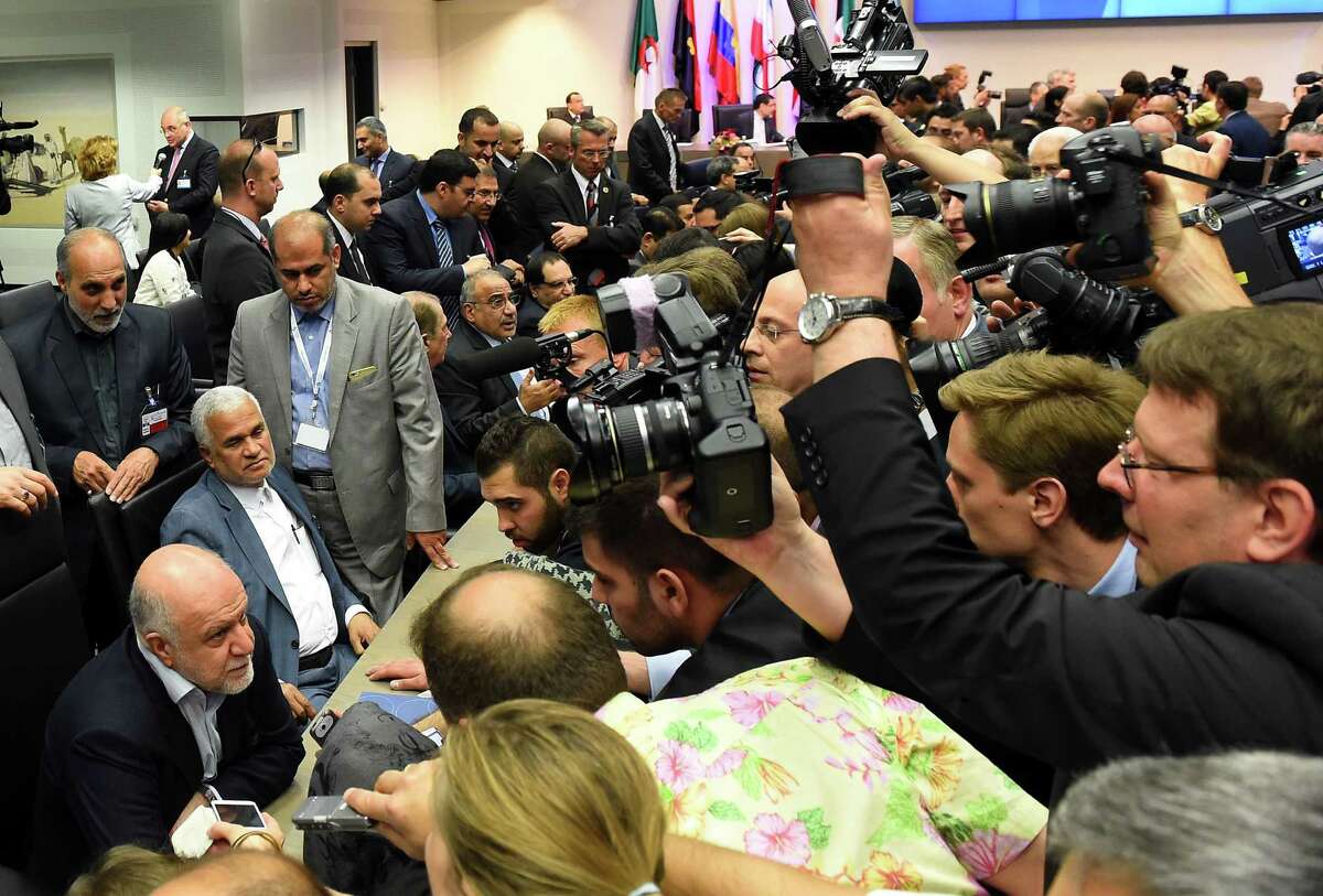 Iran's Minister of Petroleum Bijan Zangeneh (bottom left) speaks to journalists during the 167th ordinary meeting of OPEC on Friday. “They (OPEC) still matter, but they are not anymore the swing producer so they have a different role now than before,” says Giovanni Staunovo, a Zurich-based analyst at UBS AG.
