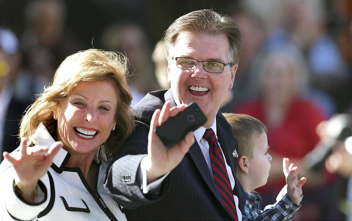 Lt. Gov. Dan Patrick, center, his wife Jan Patrick, left, and their grandson Zachary Patrick wave to the crowd during the Inauguration Ceremony Parade in Austin, Texas. Tuesday, Jan. 20, 2015.