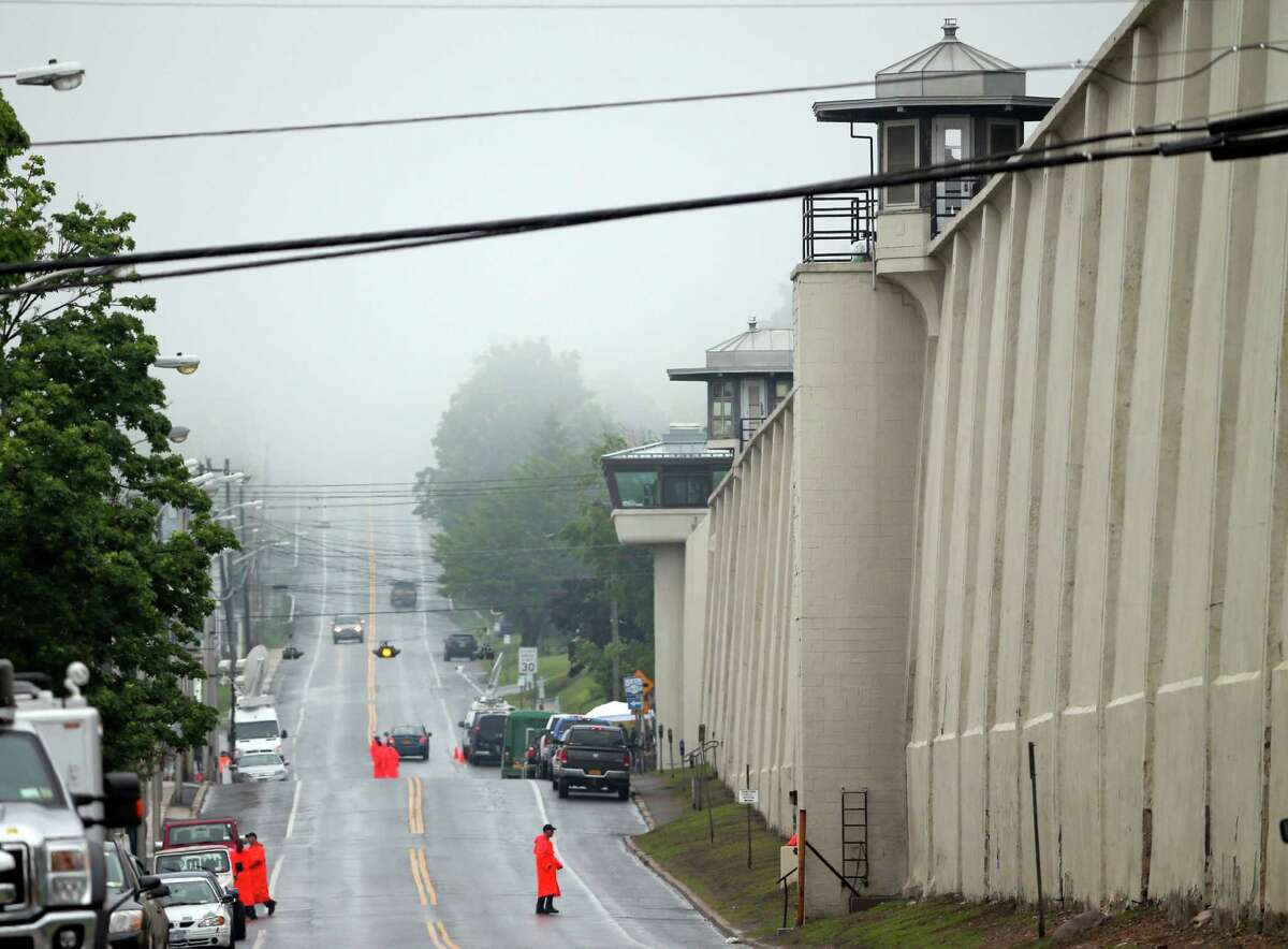 A guard stands on the wall at Clinton Correctional Facility on Monday, June 8, 2015, in Dannemora, N.Y. Two murderers who escaped from the prison by cutting through steel walls and pipes remain on the loose Monday as authorities investigate how the inmates obtained the power tools used in the breakout. (AP Photo/Mike Groll) ORG XMIT: NYMG101