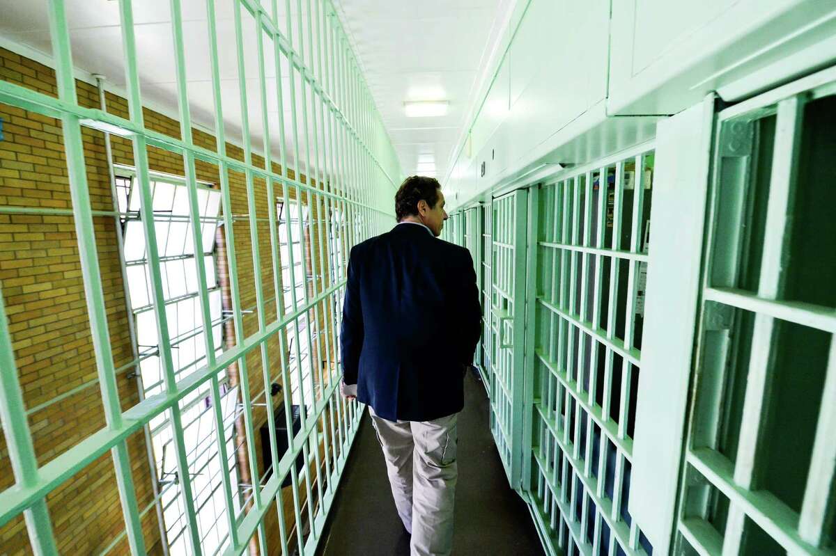 FILE - Gov. Andrew Cuomo walks past jail cells where two convicted murderers fled from the Clinton Correctional Facility June 6, 2014 in Dannemora, New York. 
