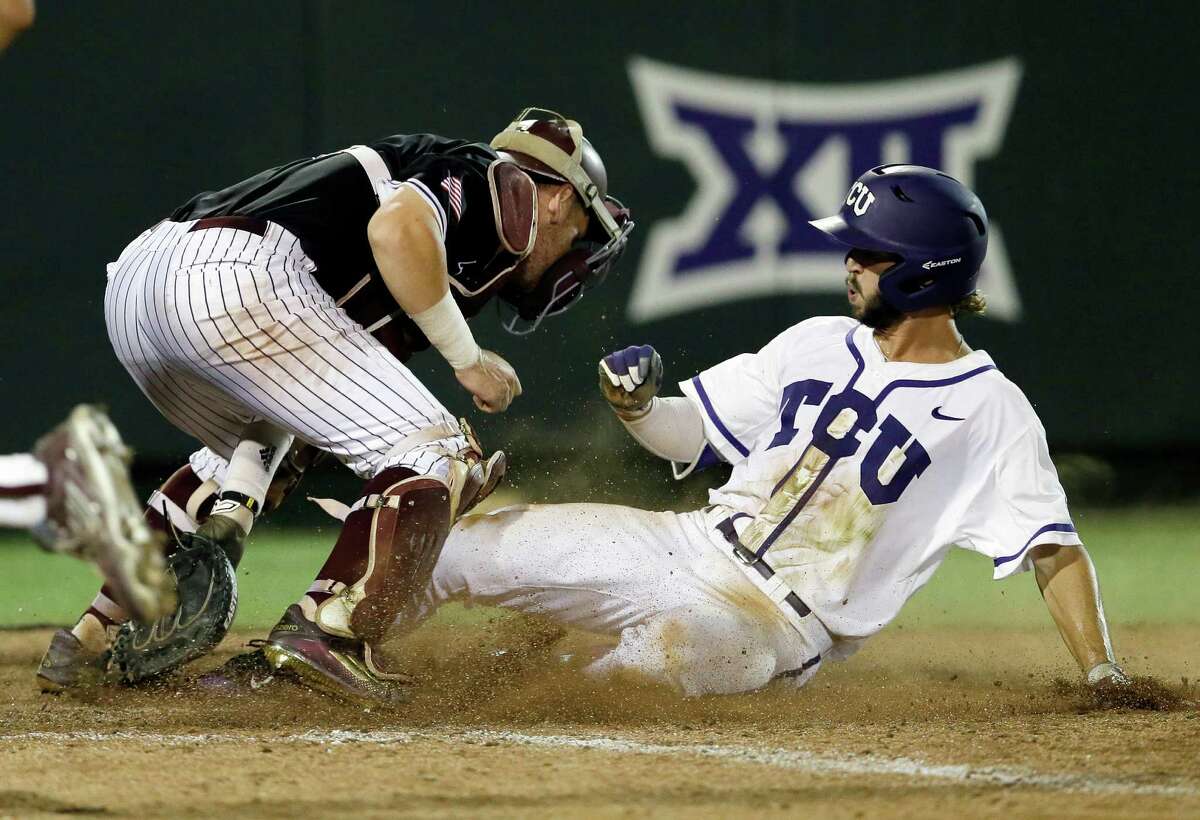 TCU's Garrett Crain, right, scores the winning run against Texas A&M catcher Michael Barash during the 16th inning of a super regional of the NCAA college baseball tournament in Fort Worth on Monday, June 8, 2015. TCU won 5-4.