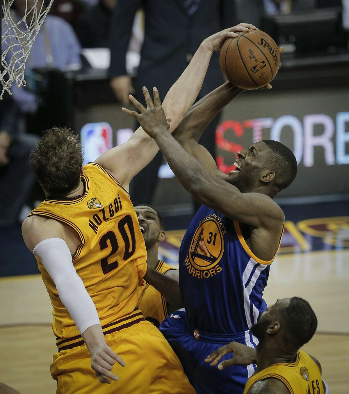 Referee Derrick Stafford (L) holds off a questioning Los Angeles