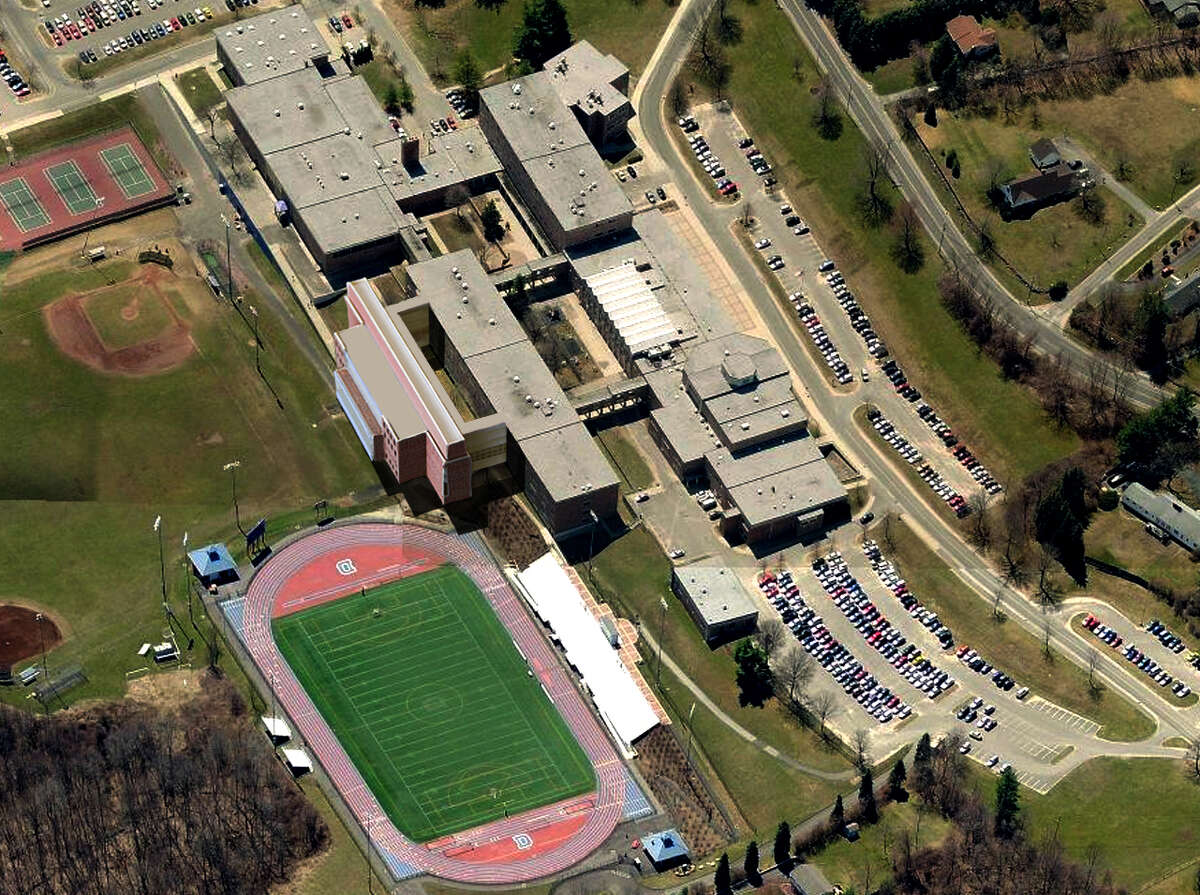 This aerial view of Danbury High School has been altered to include the proposed freshman academy wing adjacent to the football field.
