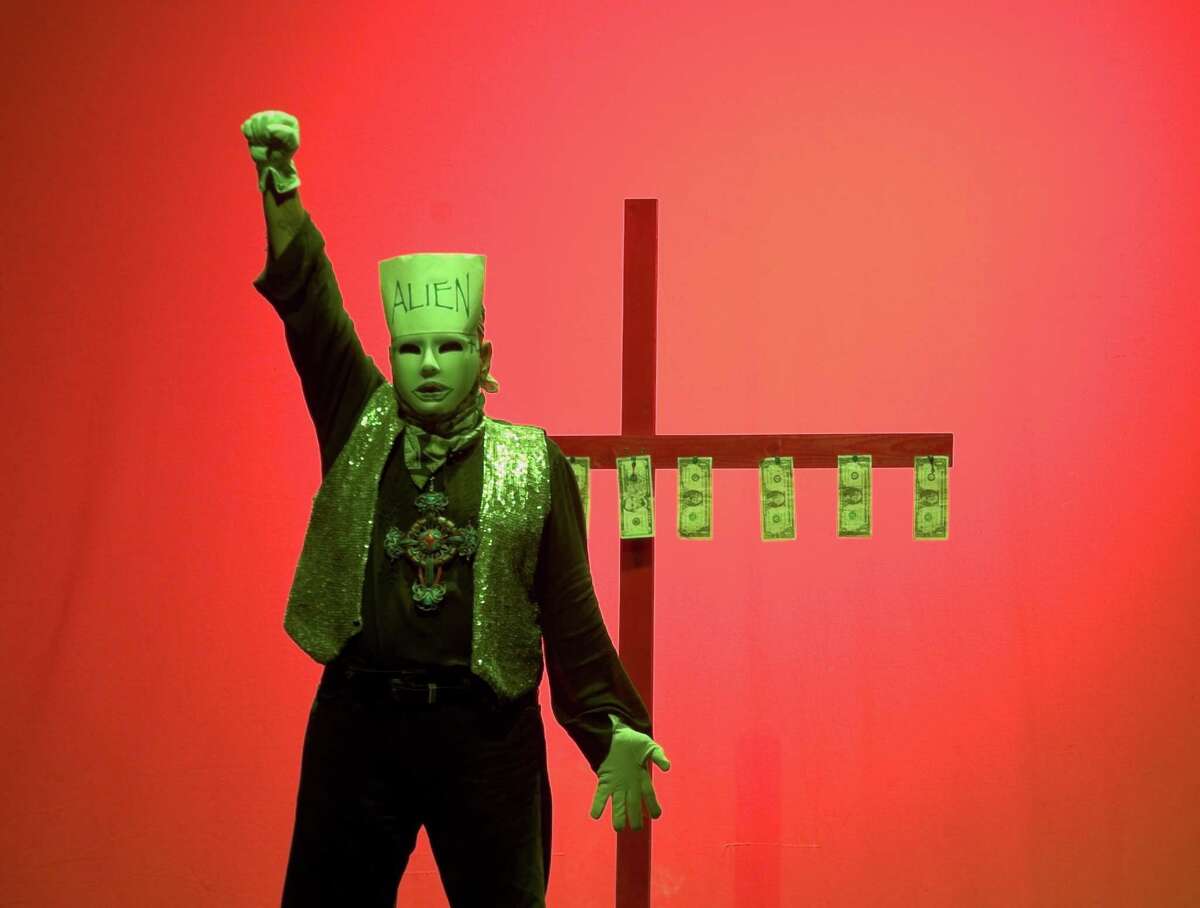 Performance artist Jose Torres-Tama plays several characters in his solo show "Aliens, Immigrants and Other Evildoers."