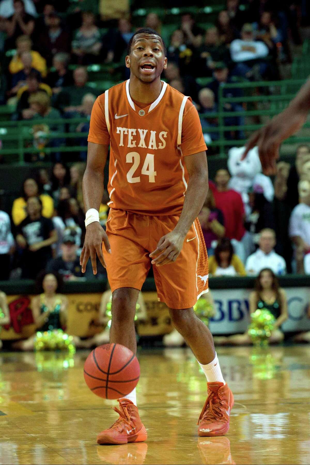 Martez Walker of the Texas Longhorns brings the ball up court against the Baylor Bears on Jan. 25, 2014 at the Ferrell Center in Waco.