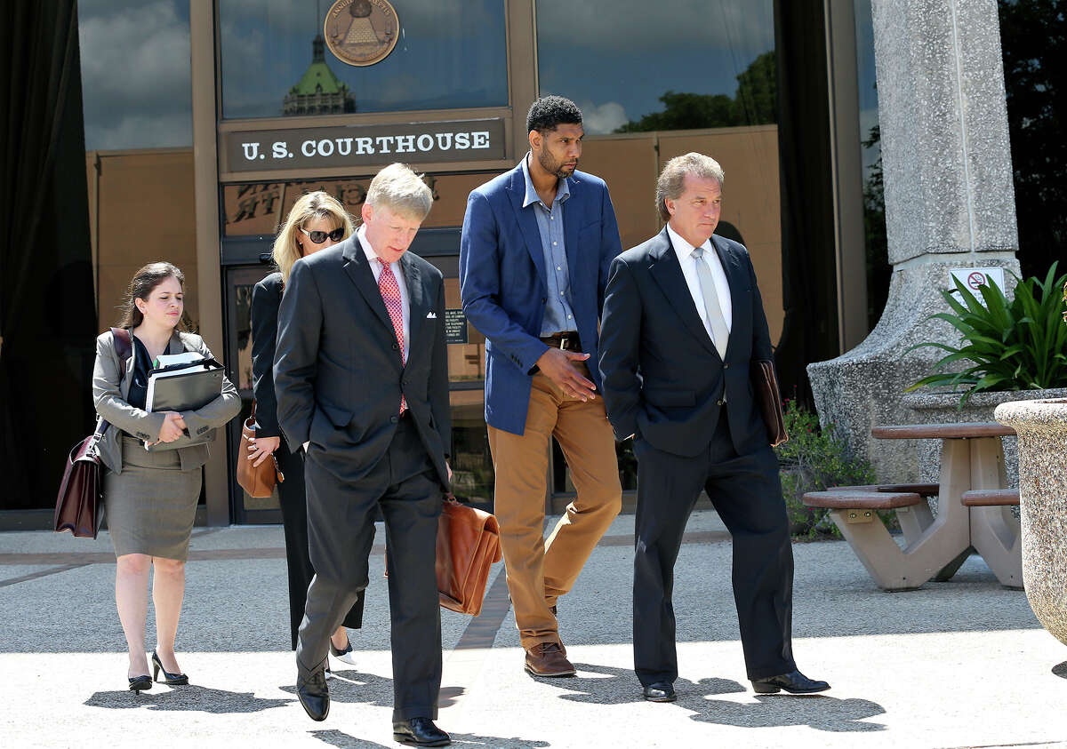 Tim Duncan exits proceedings with his legal team after he makes an appearance in federal court before U.S. District Judge Xavier Rodriguez regarding his lawsuit against Charles Banks on June 10, 2015. From left are attorney Jacqueline Garza-Rothrock, financial consultant Wendy Kowalik, attorney J. Tullos Wells, Duncan and attorney Michael D. Bernard.