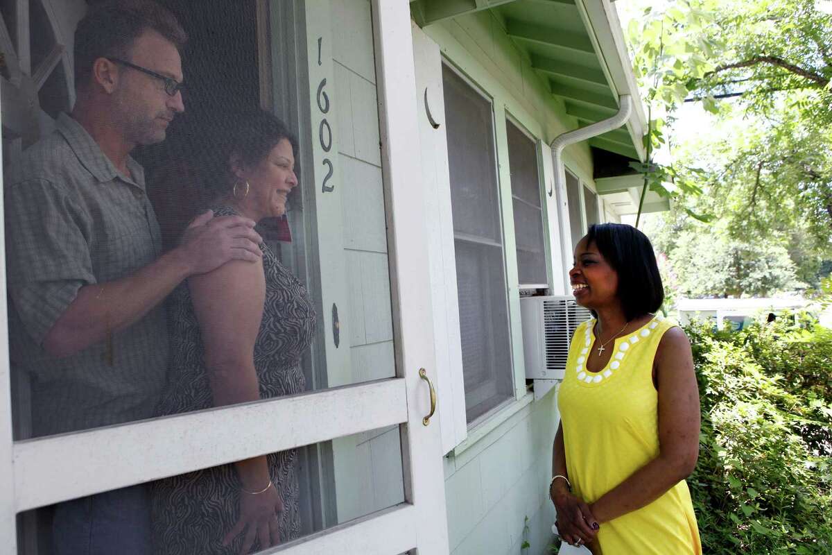 Mayor Ivy Taylor is greeted by Lilia and David Brinkmann Saturday as Taylor visited about 15 houses in District 3 asking for their support in the run-off election against Leticia Van de Putte.