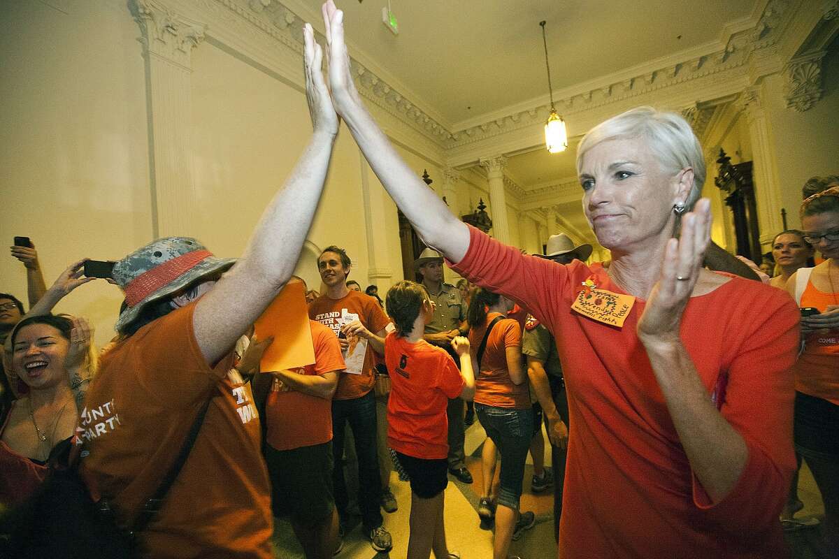 FILE - In this July 12, 2013 file photo, Cecile Richards, daughter of former Texas Gov. Ann Richards and president of the Planned Parenthood Federation of America, greets abortion rights advocates as they leave the State Capitol rotunda in Austin, Texas. Abortions have declined in states where new laws make it harder to have them - but they've also waned in states where abortion rights are protected, an Associated Press survey finds. Nearly everywhere, in red states and blue, abortions are down since 2010. "Better access to birth control and sex education are the biggest factors in reducing unintended pregnancies," said Richards. (AP Photo/Tamir Kalifa, File)