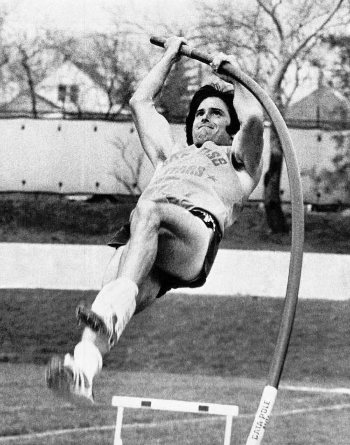 Caitlyn Jenner, then known as Bruce Jenner, starts her upward climb in the pole vault during the final day's competition on April 24, 1975 in the decathlon at the 66th drake relays in Des Moines, Iowa.