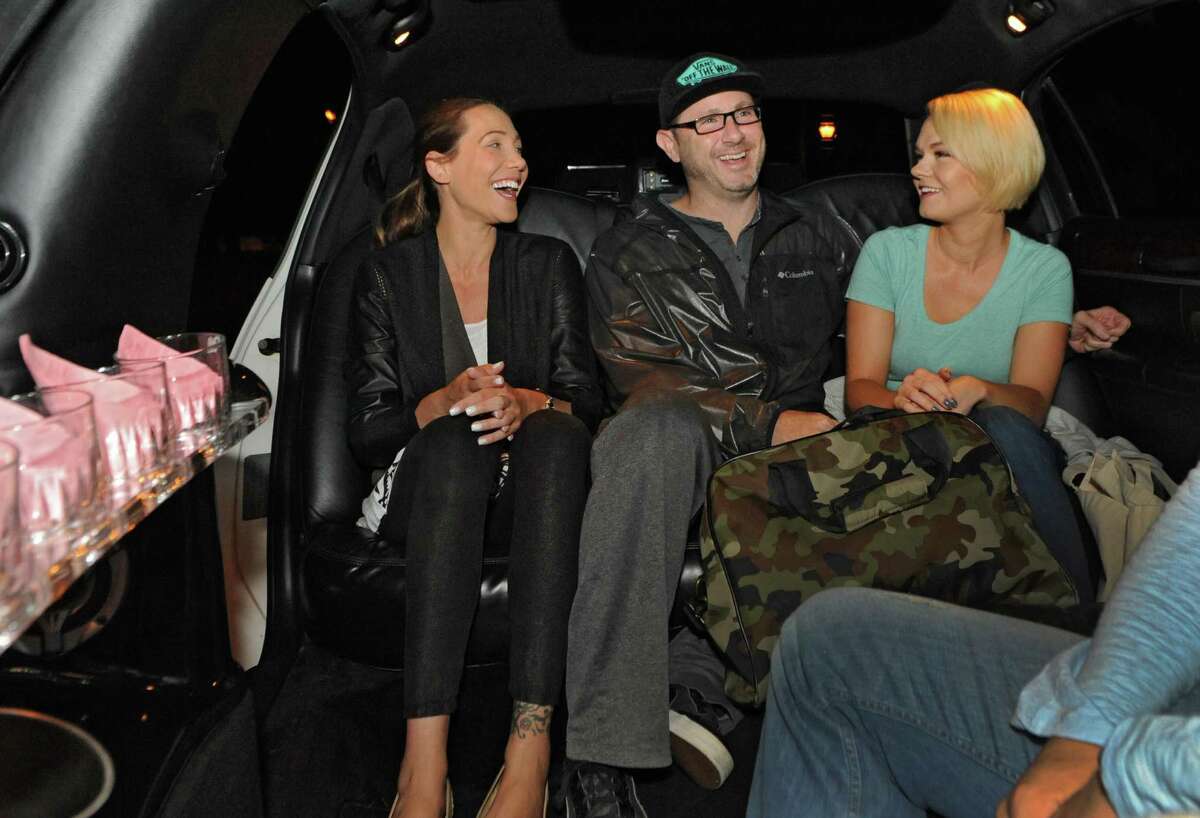 Local fashion designer Jene Luciani of Niskayuna, left, sits in a limousine with models Mike Schinnerer of Gulderland and Erin Ford of Guilderland before the head to The Today Show on Wednesday, June 10, 2015 in Niskayuna N.Y. (Lori Van Buren / Times Union)