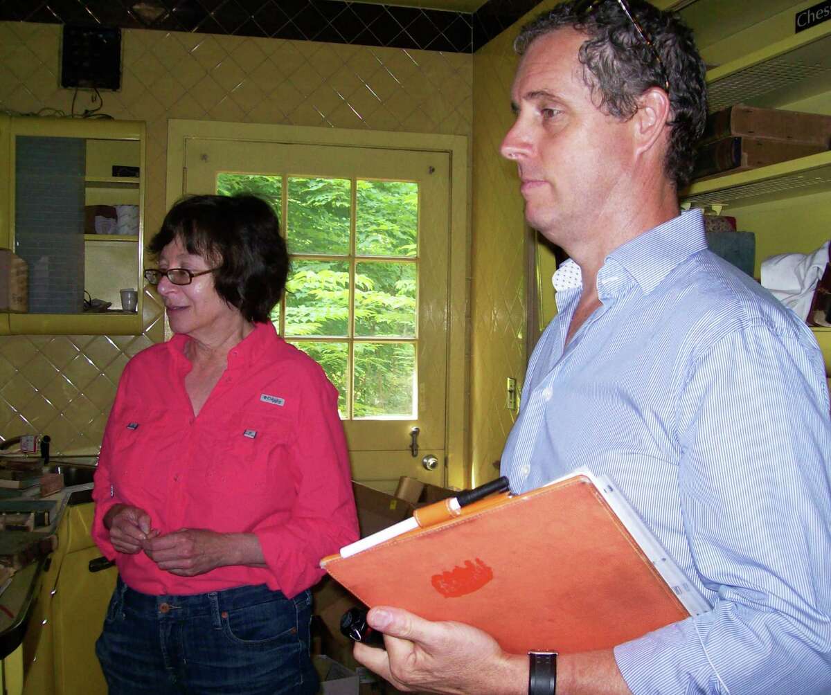 Selectman Helen Garten, left, and Morley Boyd, local historian, in the kitchen of Golden Shadows during a tour of the town-owned property.