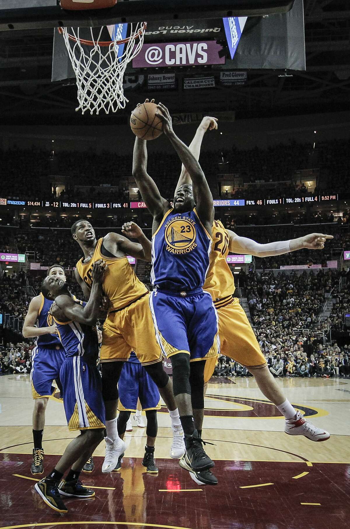 Golden State Warriors' Draymond Green pulls down a rebound in the first half during Game 4 of The NBA Finals between the Golden State Warriors and Cleveland Cavaliers at The Quicken Loans Arena on Thursday, June 11, 2015 in Cleveland, Ohio.