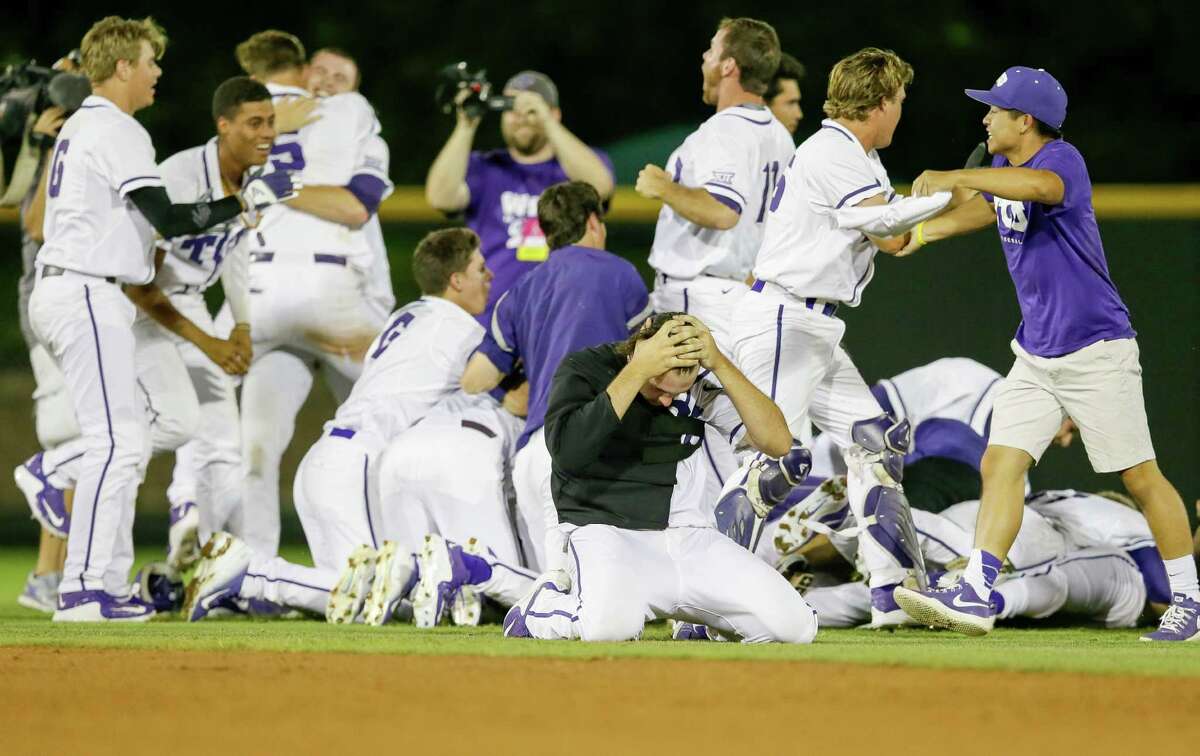TCU pitcher Mitchell Traver, front, kneels down after celebrating with teammates following the16th inning of a super regional of the NCAA college baseball tournament against Texas A&M in Fort Worth, Texas, Monday, June 8, 2015. TCU won 5-4.
