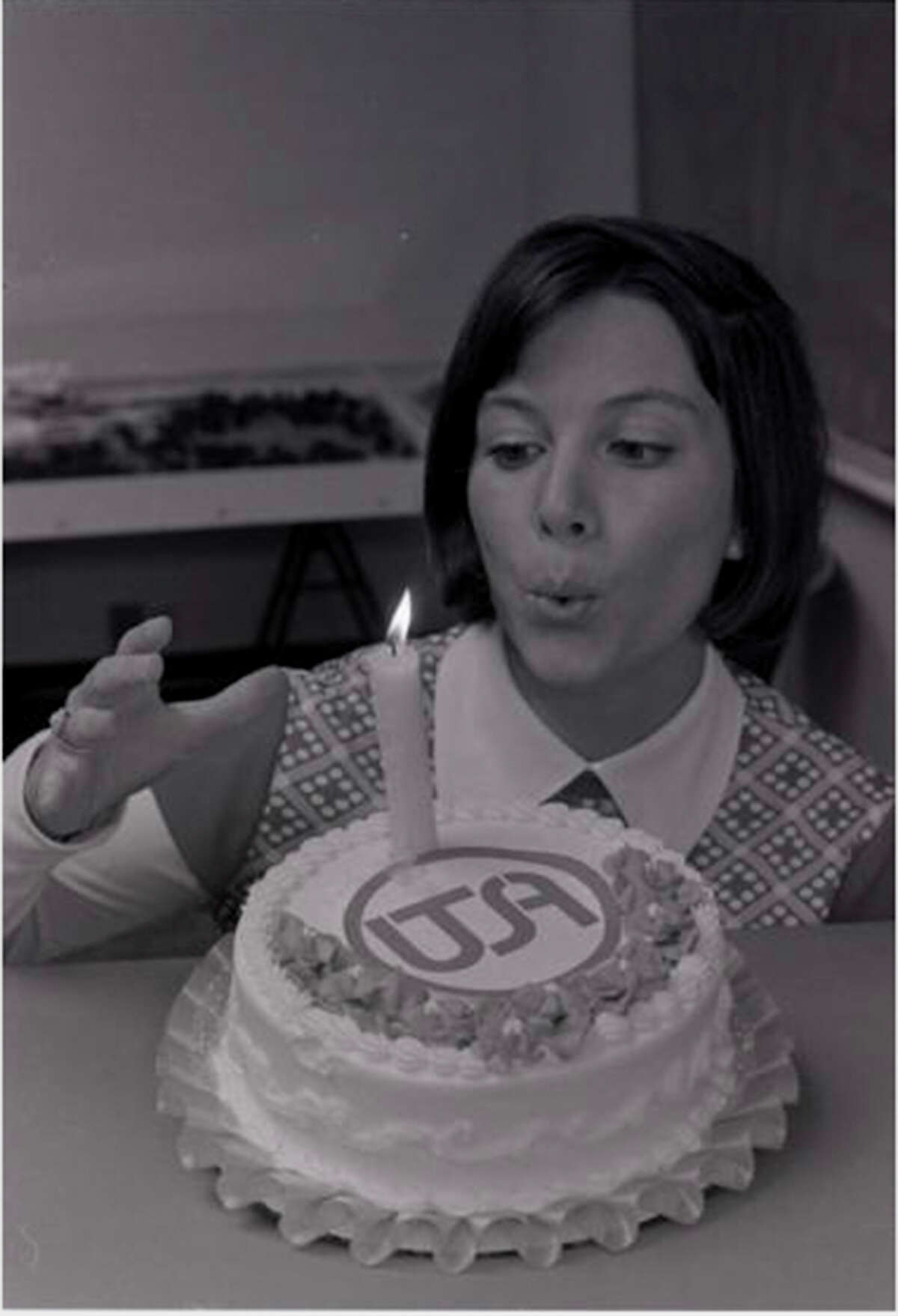 Peggy Tholen, the first student admitted to UTSA, celebrates UTSA's first year of classes in 1974.