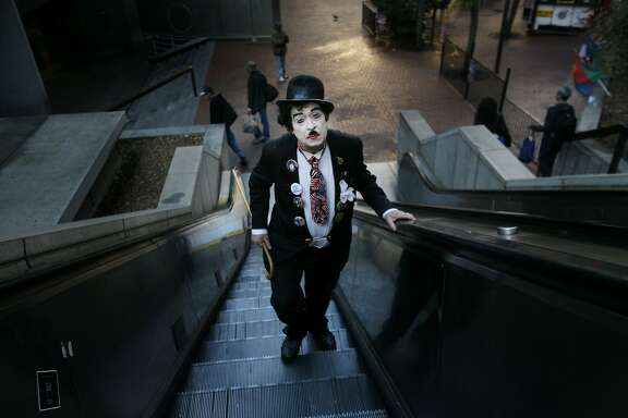Not long after the sun winked above the morning fog, Robert Martin, dressed as Charlie Chaplin, heads to his job as the host of Lori's Diner on April 21, 2008 in San Francisco Calif.