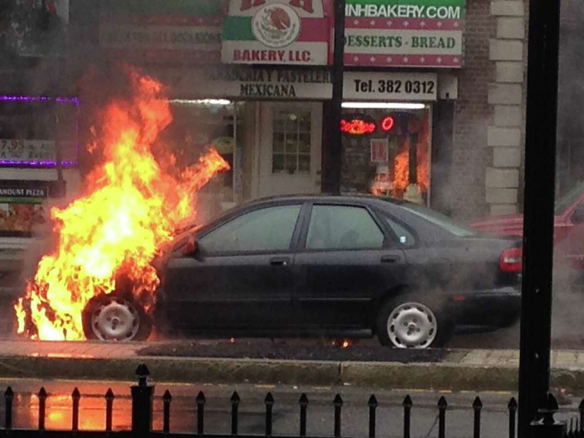A car fire Monday morning on Fairfield Avenue between Brewster and Haddon Streets in the Black Rock section of Bridgeport briefly snarled traffic while firefighters put out the flames.