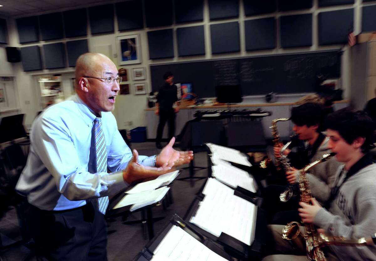 Greenwich High School Band Director, John Yoon, leads his band during rehearsal at the school in Greenwich, Thursday, Jan. 16, 2014.