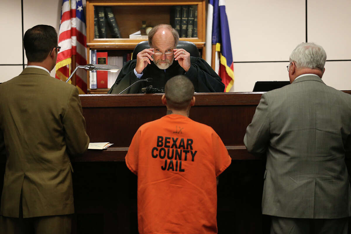 Bexar County 226th Criminal District Court Judge Sid Harle, looks at Zachary Gonzales before he is sentenced to 40 years in prison, Monday, June 15, 2015. On November 11, 2014, Gonzales fatally shot Donovon Rae Arzola, 23, on a VIA bus at the corner of North Main Avenue and Cypress Street. With Gonzales is Bexar County Prosecutor Todd Keagle, left, and defense attorney John Young.