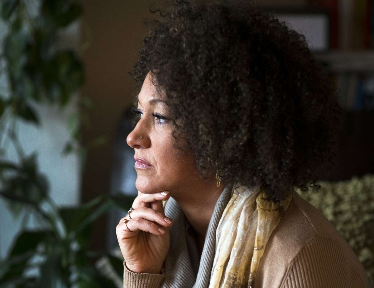 FILE - In this March 2, 2015, file photo, Rachel Dolezal, president of the Spokane chapter of the NAACP, poses for a photo in her Spokane, Wash., home. Dolezal resigned Monday, June 15, 2015, amid a furor over racial identity that erupted when her parents came forward to say she has been posing as black for years when she is actually white. (Colin Mulvany/The Spokesman-Review via AP, File)
