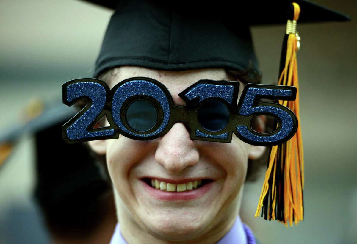 Nick Beecher oversized "2015" sunglasses Monday during the Jonathan Law High School commencement.