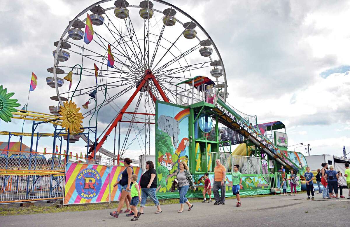 Fair goers on the midway at the Altamont Fair Thursday August 14, 2014, in Altamont, NY. (John Carl D'Annibale / Times Union) ORG XMIT: MER2014081415065202