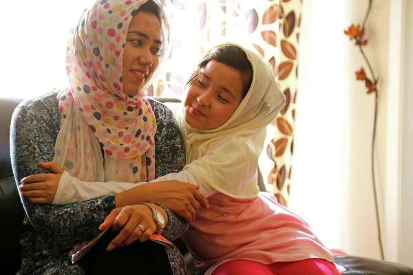 Afghan refugees Zeba Mohammad Arif left, and her daughter Mahnaz Kashmiri in their apartment in Houston.