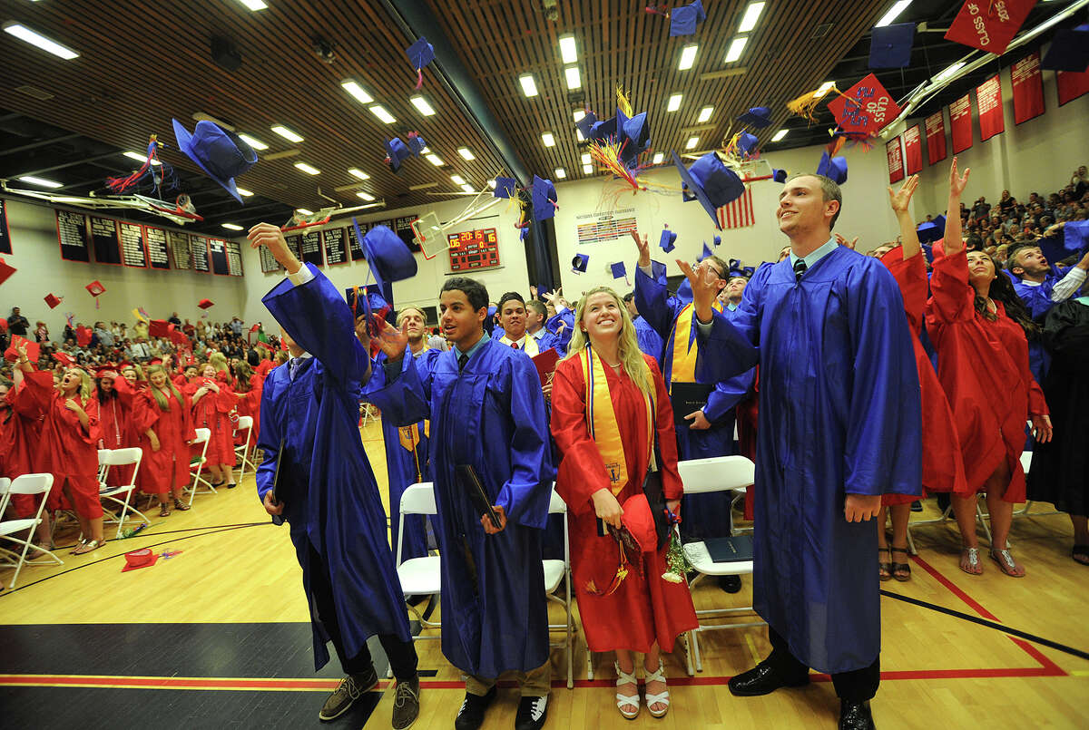 Caps fly high at the conclusion of the Foran High School graduation in Milford, Conn. on Tuesday, June 16, 2015.