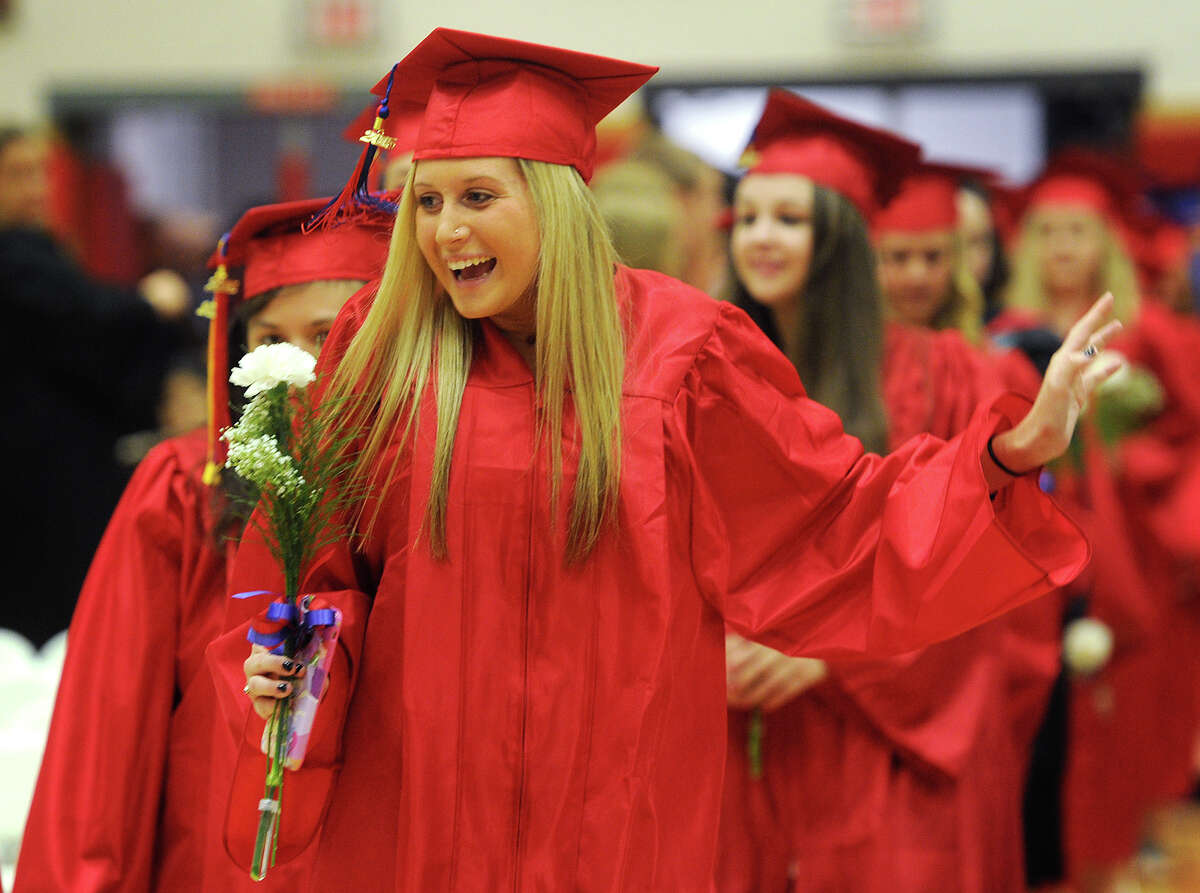 Graduate Hannah Birenbaum gets excited as she walks to her seat at the Foran High School graduation in Milford, Conn. on Tuesday, June 16, 2015.