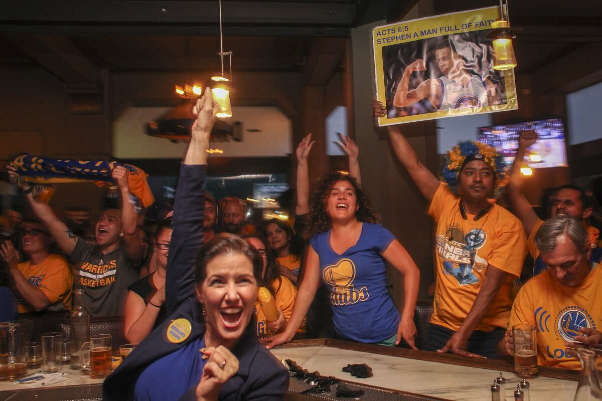 Libby Schaaf, Mayor of Oakland cheers with fans during game 6 of the NBA finals at the Tribune Tavern in downtown Oakland on June 16th 2015. The Golden State Worriers beat the Cleveland Cavaliers to win the championship.