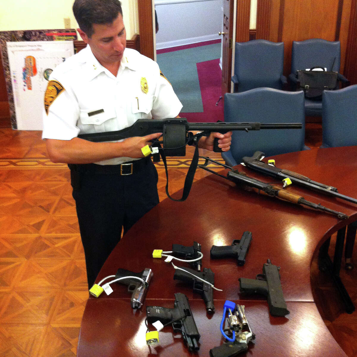 Bridgeport Assistant Police Chief James Nardozzi displays a Streetsweeper shotgun turned in during one of the cityâÄôs previous gun buyback programs.The department is hosting another buyback on Saturday and seeking financial support to help pay for the weapons.