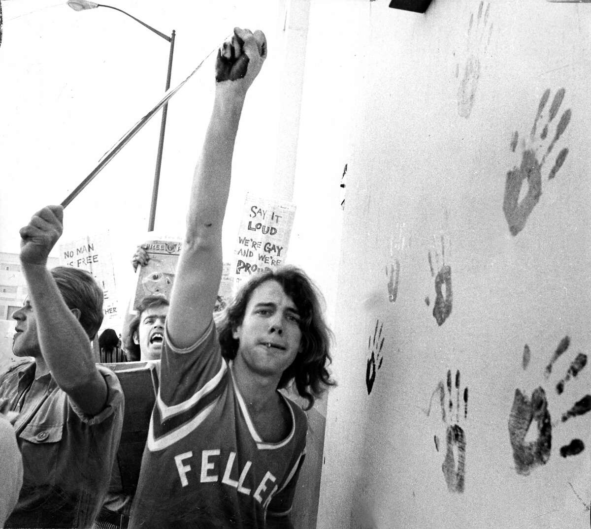 Nov. 1, 1969: Picketers support a pro-gay cause in 1969, using paint to make handprints on a San Francisco wall.
