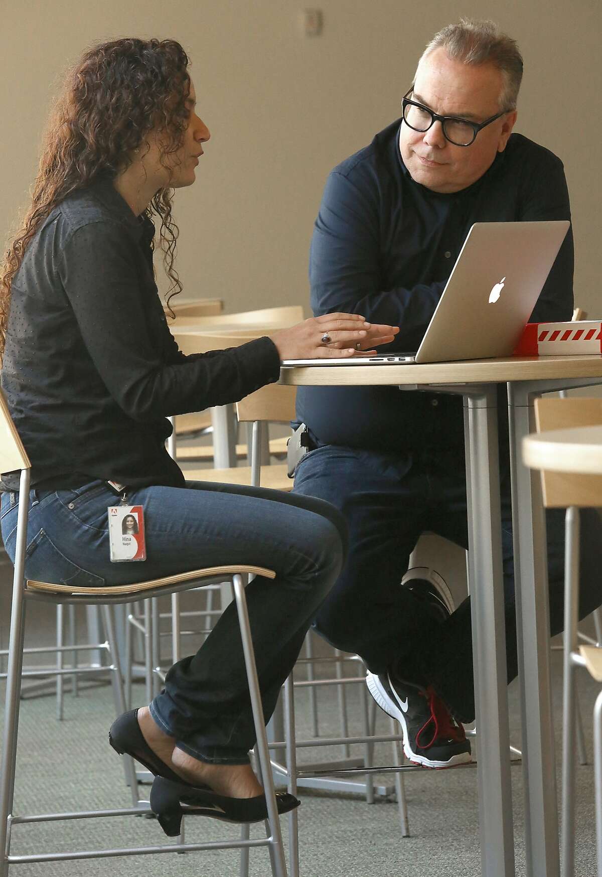 Adobe vice president for creativity Mark Randall (right) talks with product manager Hina Naqvi (left) on Wednesday, June 17, 2015.