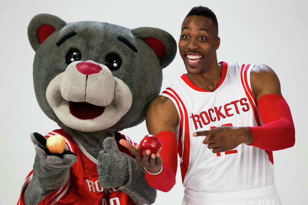 Houston Rockets mascot Clutch, left, poses for a photo with center Dwight Howard during Rockets media day at Toyota Center Monday, Sept. 29, 2014, in Houston. ( Brett Coomer / Houston Chronicle )
