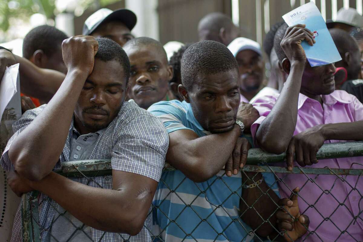 Haitians queue up to legalize their status at the Interior Ministry in Santo Domingo, on June 17, 2015. Tens of thousands of people are facing deportations as a deadline for foreigners, most of them being Haitians, to legalize their status as undocumented alien is due to expire midnight. AFP PHOTO / ERIKA SANTELICESERIKA SANTELICES/AFP/Getty Images