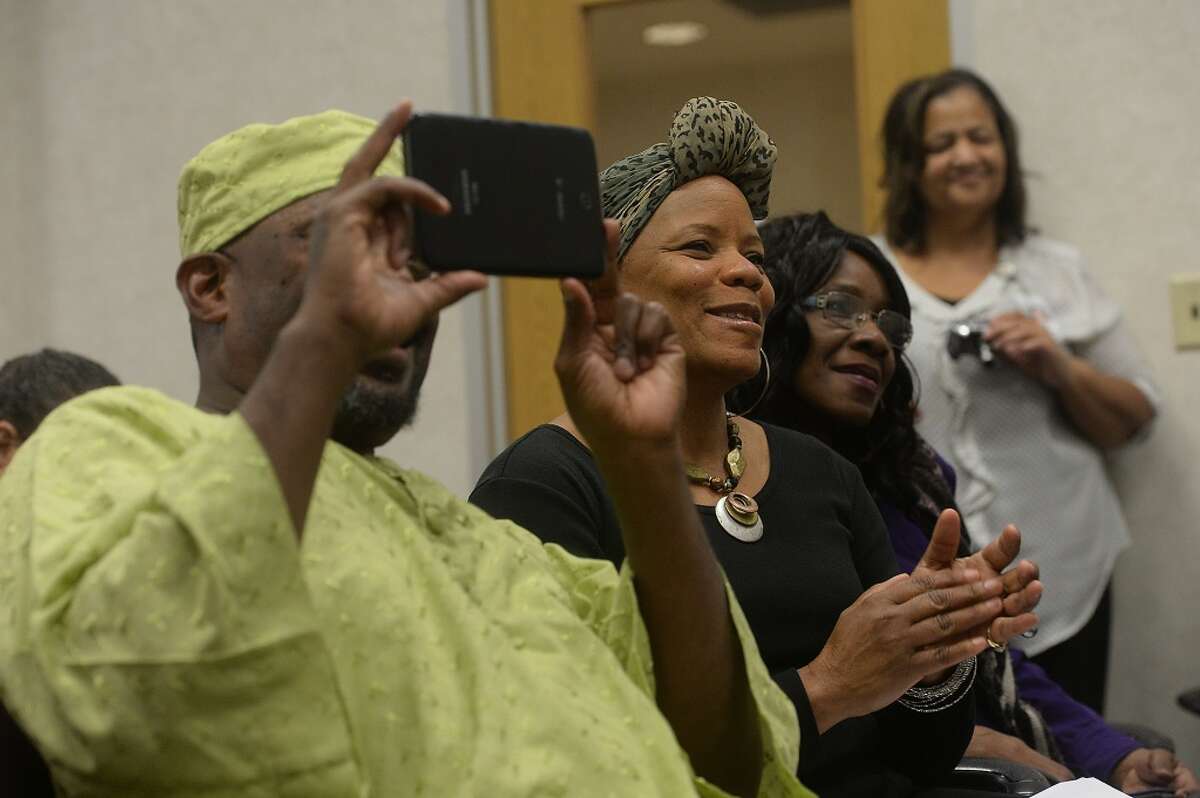 From left, poets Derek Toussaint, Dorothy Clover, and her friend Patsy Winters enjoy the performance of Barbara Lynn during during the Black History Month program held Tuesday night at the Theodore Johns Branch Library. Music, poetry and dance were among the cultural highlights celebrating the expressions of local black artists. Photo taken Tuesday, February 10, 2015 Kim Brent/The Enterprise