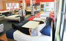 Area manager David Bucklew adjusts a bed for a customer   at the Mattress Firm on W. Gray Monday May 01, 2015.(Dave Rossman photo)