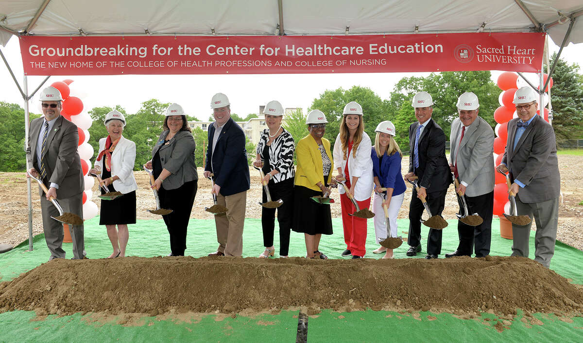 Breaking ground for Sacred Heart University's new Center for Healthcare Education are, from left, City of Bridgeport Chief Administrative Officer Andrew Nunn (representing Mayor Bill Finch), incoming dean of the College of Nursing Mary Alice Donius, Bridgeport City Council members Tom McCarthy, AmyMarie Vizzo-Paniccia and Michelle Lyons, College of Health Professions Dean Patricia Walker, nursing student Katherine Bernatchez, occupational therapy student Lindsey Turse MSOT, Trustee Thomas L. Rich, Vice President for Finance and Administration Michael Kinney and President John J. Petillo.