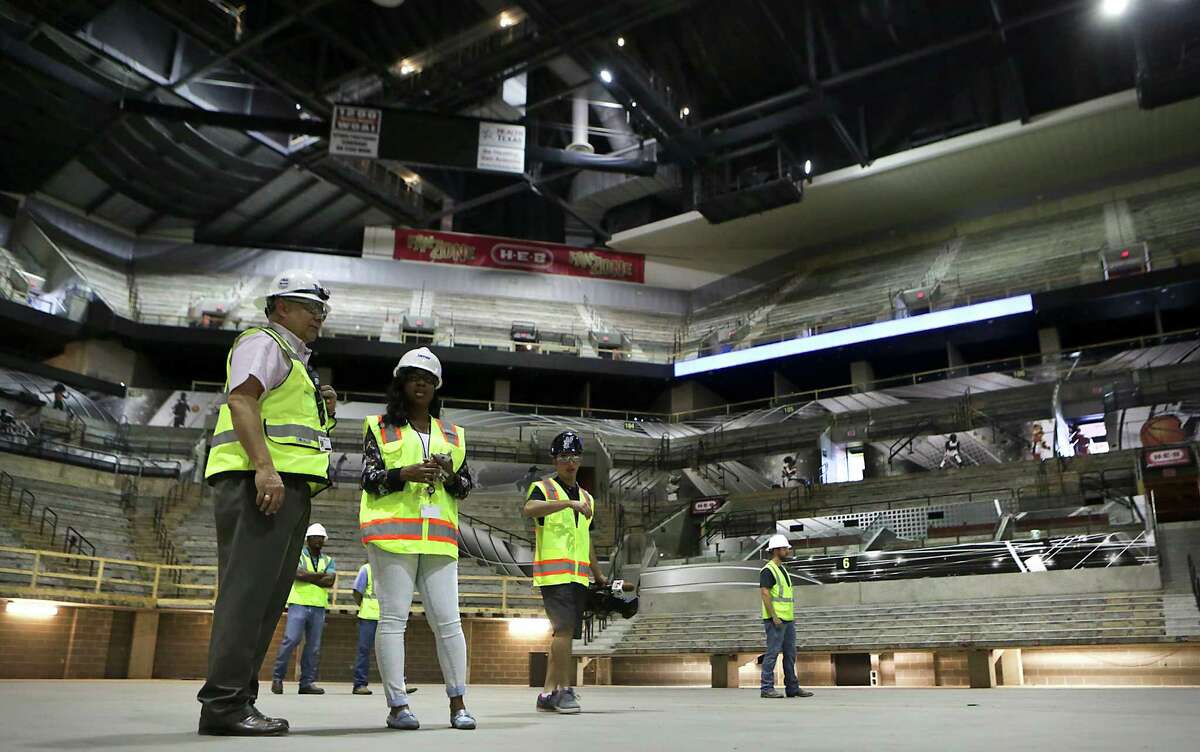Media and construction personel stand in on the base floor of The AT&T Center on Thursday June 18, 2015, during a tour by the Hunt Construction Group and Spurs representatives. The Spurs home is going through a remodel.