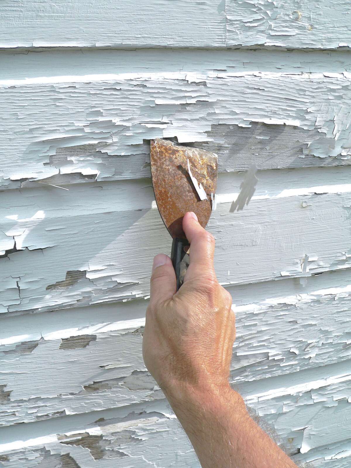 Peeling or chipped paint is best repair come summer. (Fotolia)